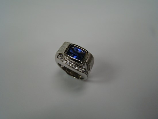 Rectangular Cushion Cut Sapphire Ring in a Brushed White Gold and Channel Set Diamond Setting Image