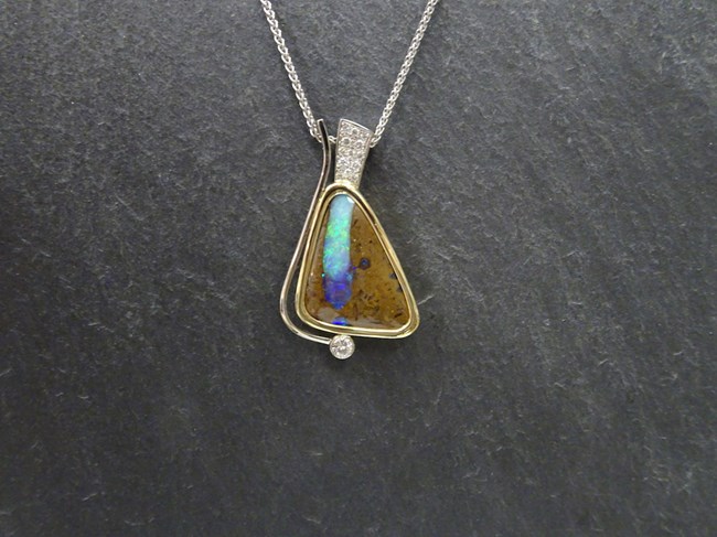 Boulder Opal in White & Yellow Gold with Pave Diamonds and a Bezel Set Canadian Solitaire Diamond Image