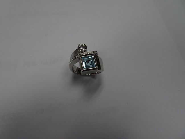 Bezel Set Princess Cut Aquamarine Ring in a White Gold and Pave Diamond Setting with a Bezel Set Round Cut Diamond Image
